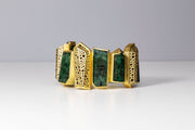 Todd Reed bracelet with Emeralds(~263.08ct), black brilliant cut diamonds(~6.35ct), 18k yellow gold, and 14k white gold.